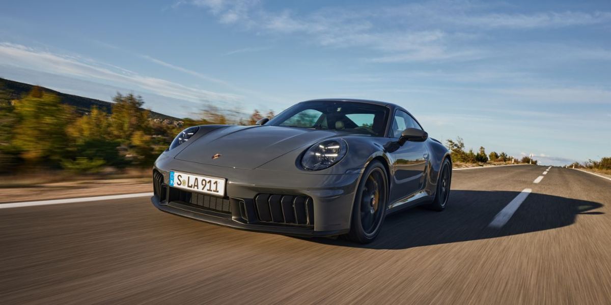A Porsche 911 Carrera GTS on an open road.